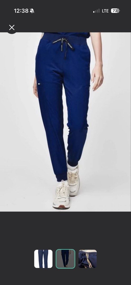 White Coat Navy Blue Jogger Scrub Pants (Category: Other Bottoms) located in Quezon City. Submitted by trishaysa16 (Listing ID 1443354486, Image 2). Description: - Brand: White Coat - Color: Navy Blue - Style: Jogger Scrub Pants - Features: Elastic waistband with drawstring, multiple zippered side pockets, cuffed ankles - Benefits: Comfortable and functional for work.