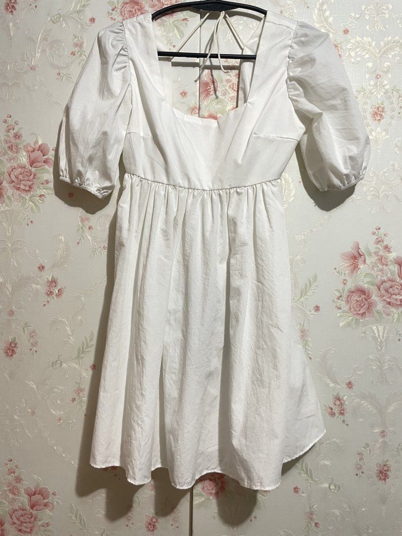 White Puff Sleeve Square Neck Mini Dress (Category: Dresses) located in Paranaque City. Submitted by annchang0 (Listing ID 1443492638, Image 1). Description: - Cute white mini dress - Puff sleeves - Square neckline - Ties at the back - Gathered waist with a flowy skirt - Versatile for casual outings or dressing up - Easy to style.
