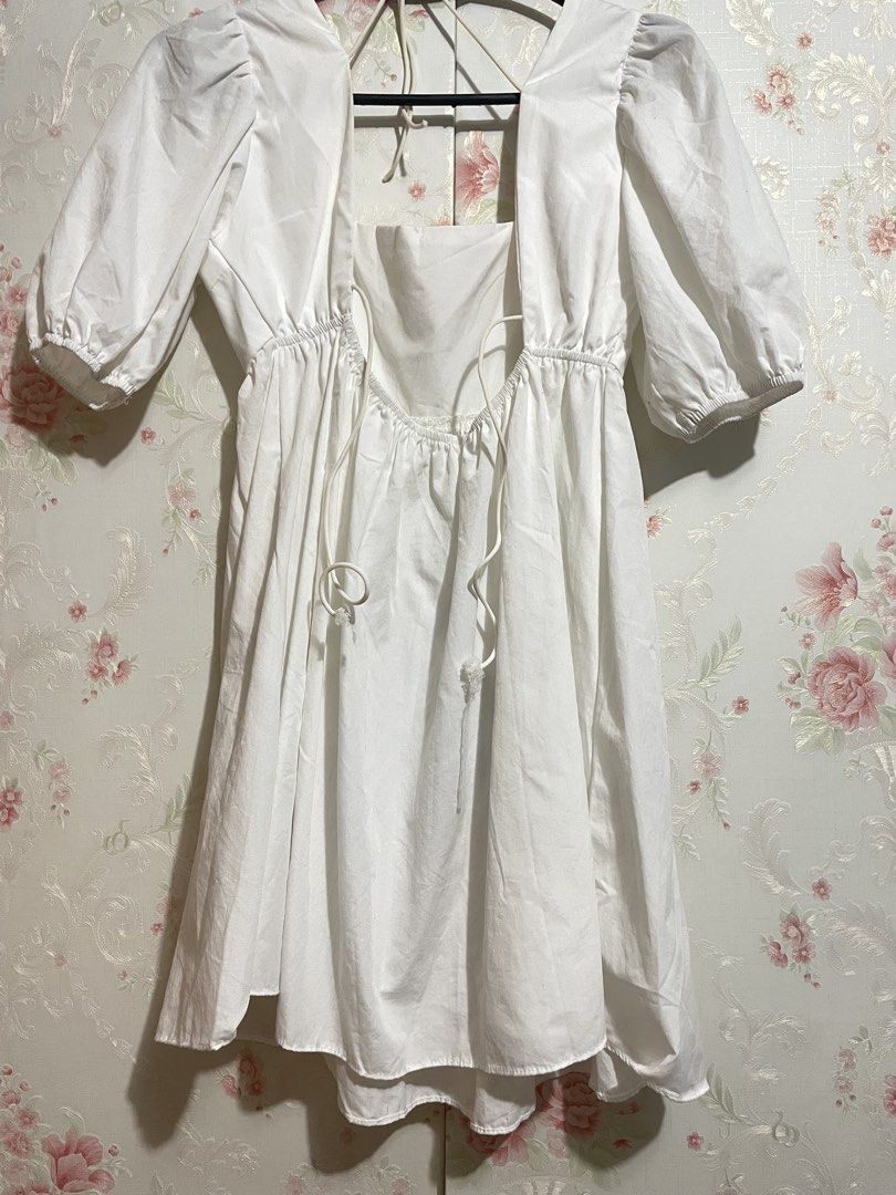 White Puff Sleeve Square Neck Mini Dress (Category: Dresses) located in Paranaque City. Submitted by annchang0 (Listing ID 1443492638, Image 2). Description: - Cute white mini dress - Puff sleeves - Square neckline - Ties at the back - Gathered waist with a flowy skirt - Versatile for casual outings or dressing up - Easy to style.