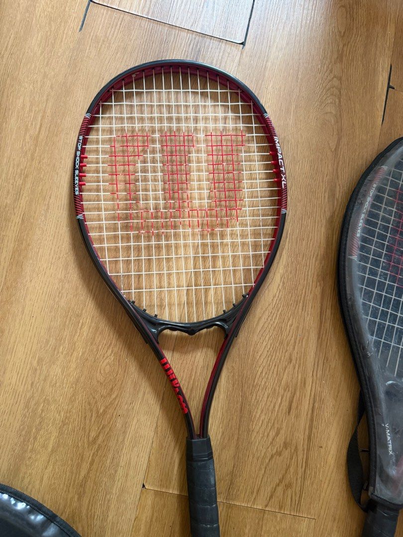 Wilson Impact XL Tennis Racket with Cover (Category: Racket and Ball Sports) located in Pasig City. Submitted by riccimoi (Listing ID 1443328740, Image 3). Description: - Wilson Impact XL tennis racket - Red and black color scheme - Grip shows some signs of wear - Comes with a protective cover - Ready for immediate use on the court 1000 each .