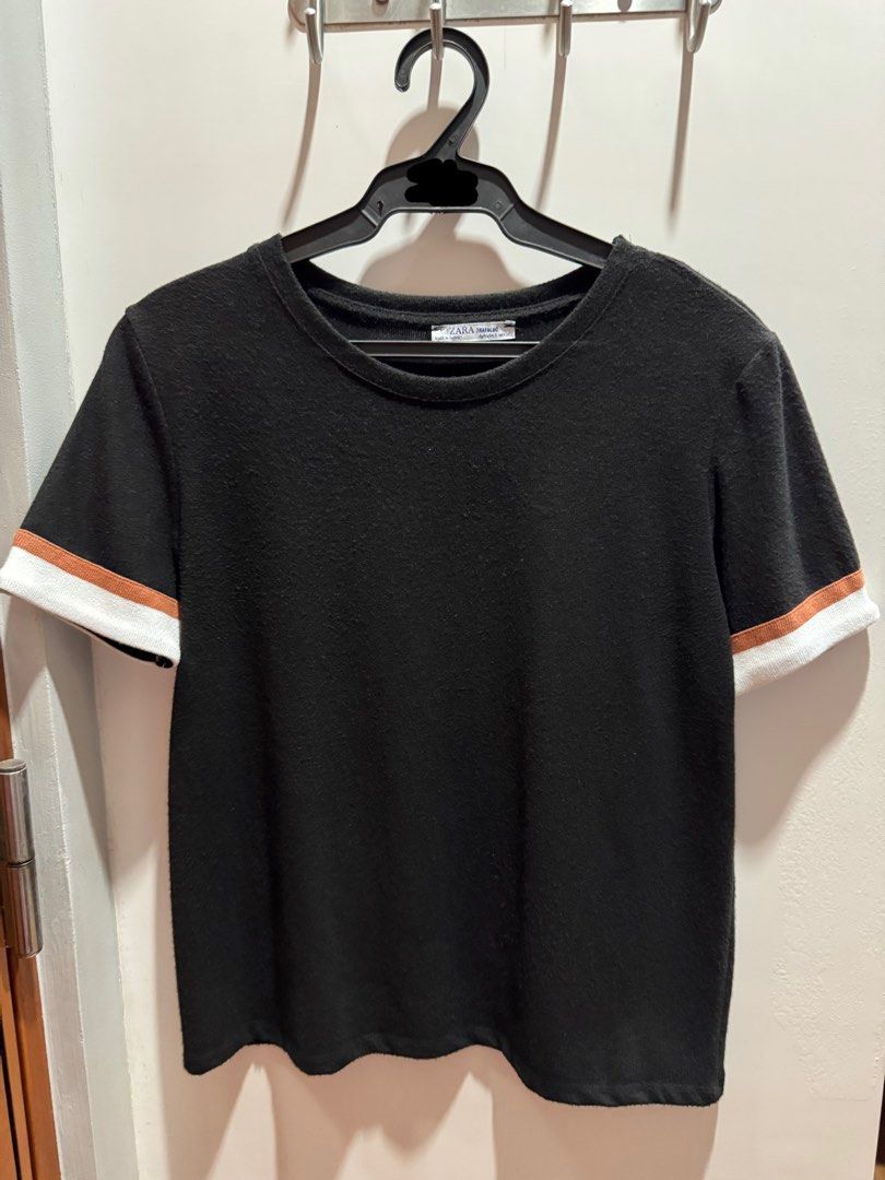 Zara Black T-Shirt with Striped Cuffs (Category: Shirts) located in Makati City. Submitted by _gaby_ (Listing ID 1443379521, Image 1). Description: - Brand: Zara - Color: Black - Sleeves: Short with white and tan striped cuffs - Occasion: Casual wear - RFS: decluttering.