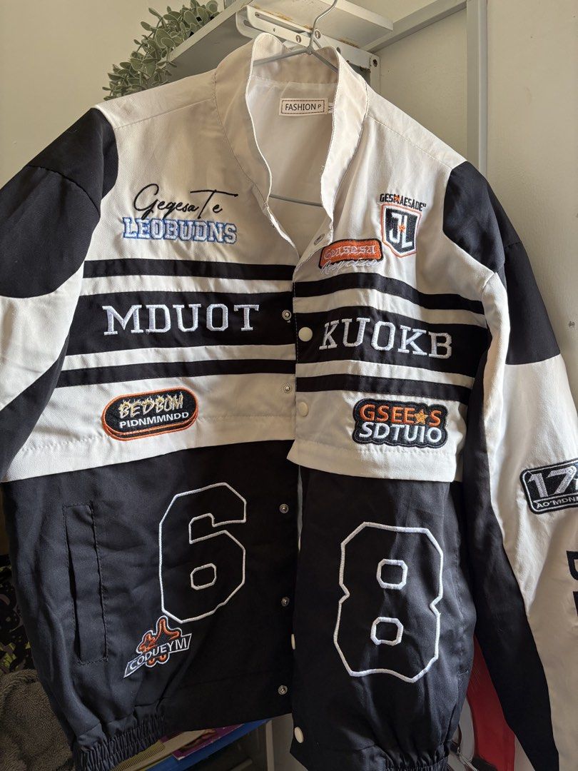 2 in 1 Jacket / Racing / Varsity (Category: Coats, Jackets and Outerwear) located in Daet. Submitted by raqijimenez (Listing ID 1443527372, Image 3). Description: - Cool black and cream varsity jacket - Features numerous patches and embroidery - Button-up front with an underlying zip closure - Ribbed cuffs and hem for a snug fit - Perfect for achieving a streetwear look - Designed for an oversized fit Small - Large Small if you want it oversized 