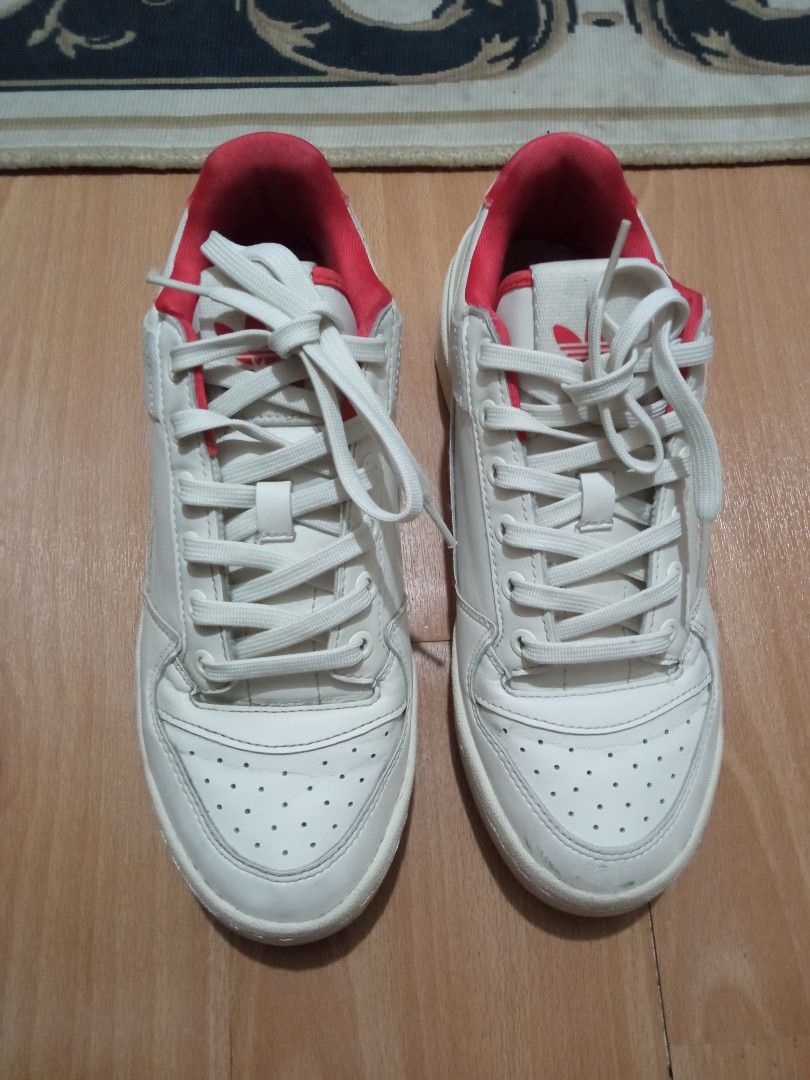 Adidas Parley Sneakers White Red (Category: Sneakers) located in Manila. Submitted by studiozero51579 (Listing ID 1443606494, Image 1). Description: - White Adidas sneakers with striking red accents. - Made in Indonesia. - Size: US 6 / UK 5.5 / FR 38.5. - Features distinctive Parley branding. - Red soles proudly display the Adidas logo. - Ideal for everyday casual wear..