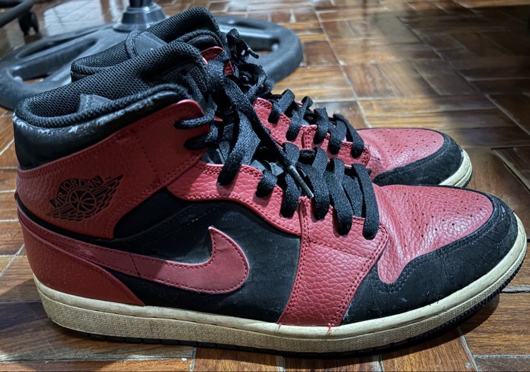 Air Jordan 1 Mid Red Black Sneakers (Category: Sneakers) located in Quezon City. Submitted by dkzweb (Listing ID 1443661087, Image 3). Description: - Air Jordan 1 Mid Sneakers - Colorway: Red & Black - Size: US 11 (UK 10, EUR 45, CM 29) - Made in Vietnam - Condition: Used, with some signs of wear on the toe box and sole - Still has plenty of life left for many more wears - A classic pair of Jordans to add to your collection -EU45/UK10/US11.