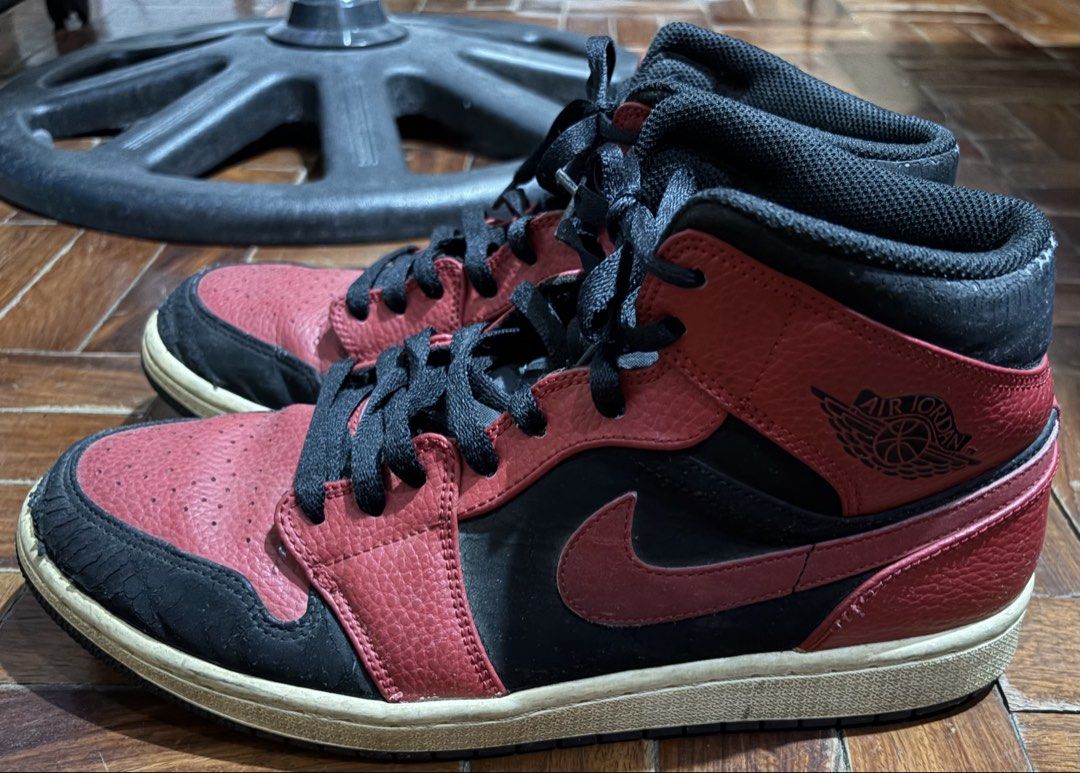 Air Jordan 1 Mid Red Black Sneakers (Category: Sneakers) located in Quezon City. Submitted by dkzweb (Listing ID 1443661087, Image 2). Description: - Air Jordan 1 Mid Sneakers - Colorway: Red & Black - Size: US 11 (UK 10, EUR 45, CM 29) - Made in Vietnam - Condition: Used, with some signs of wear on the toe box and sole - Still has plenty of life left for many more wears - A classic pair of Jordans to add to your collection -EU45/UK10/US11.