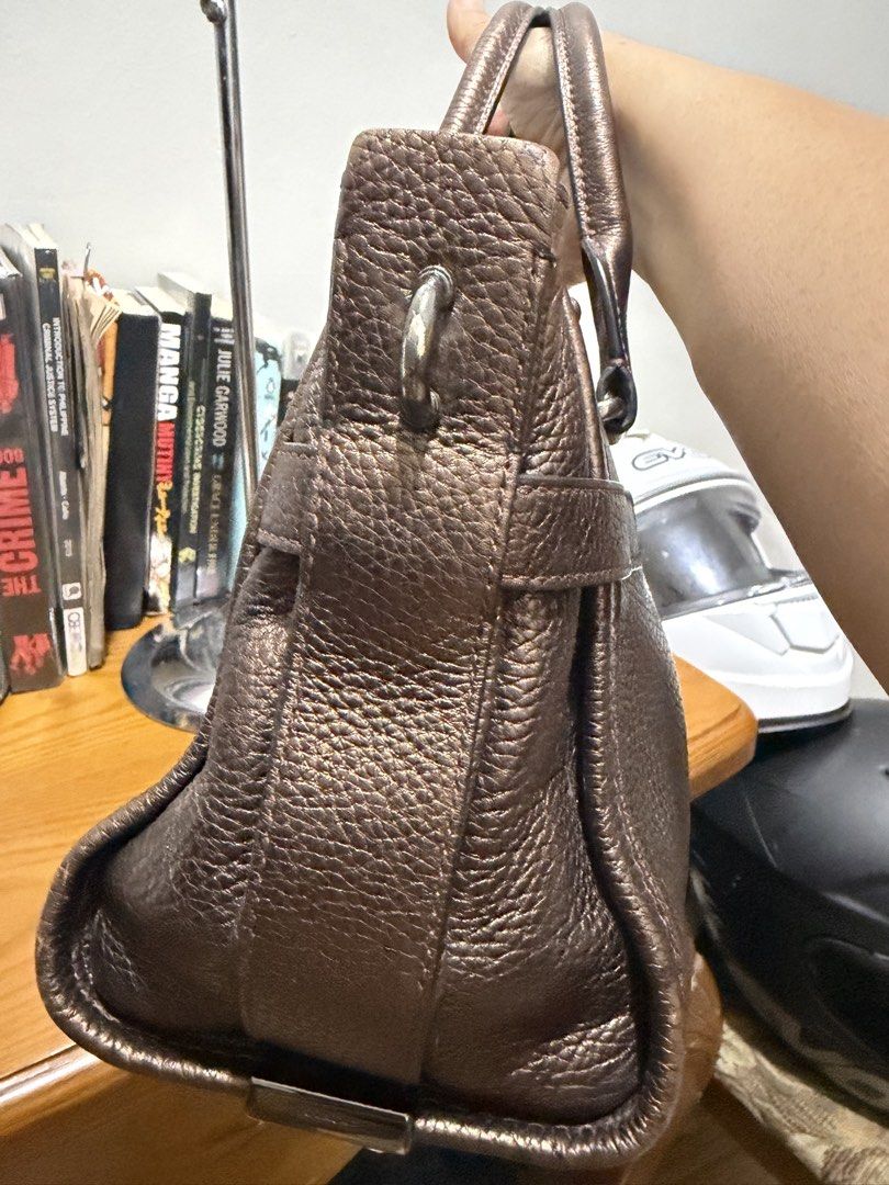 Authentic Coach Swagger 27 Metallic Bronze (Category: Luxury Bags & Wallets) located in General Santos City (Dadiangas). Submitted by prelovedpickers (Listing ID 1443662535, Image 3). Description: selling Authentic Coach Swagger 27 Metallic bronze missi sling and Hangtag With slight spot pebbled leather rate 10/10.
