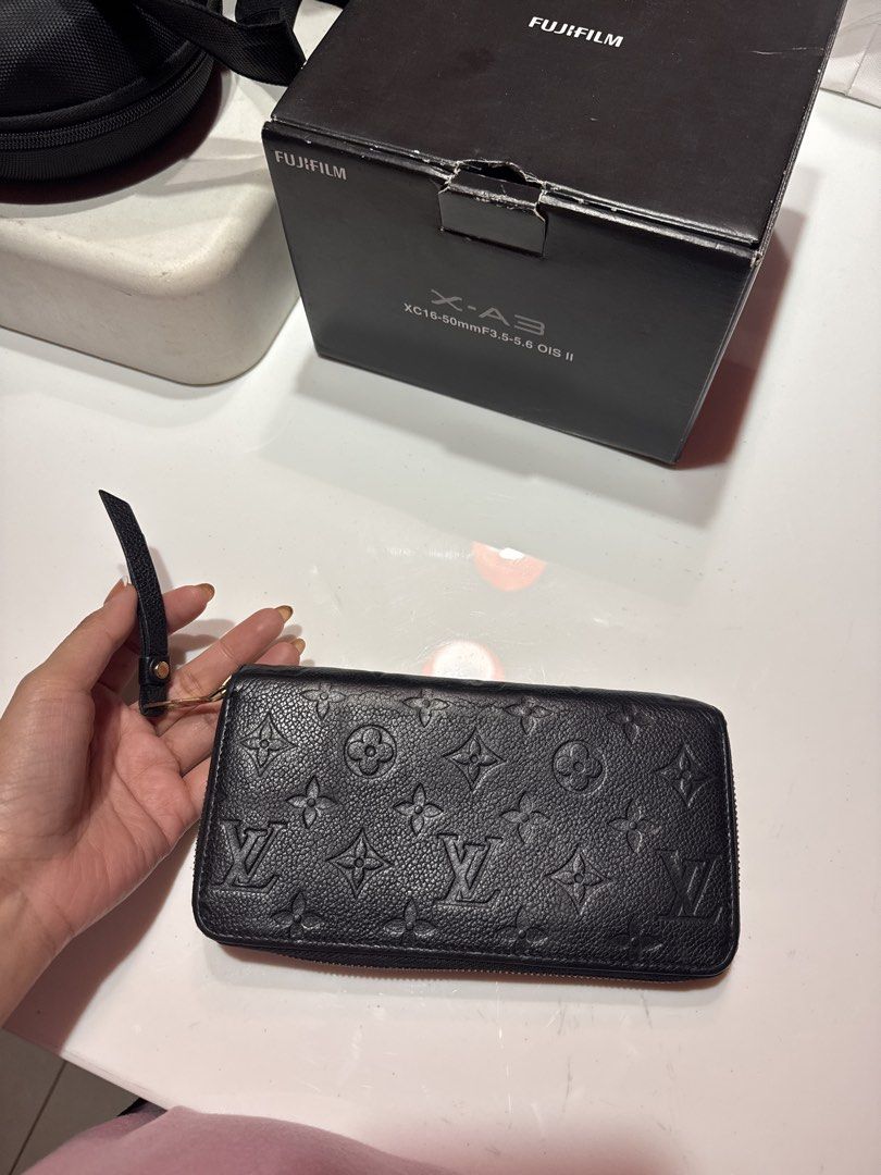 Authentic Louis Vuitton Monogram Empreinte Long Wallet (Category: Luxury Bags & Wallets) located in Quezon City. Submitted by jajadeclutteredstuffs (Listing ID 1443551372, Image 1). Description: - Authentic Louis Vuitton wallet in classic black monogram empreinte leather. - Secure zip-around closure. - Ample interior space for cards, cash, and essentials. - Ideal for everyday use or as a travel companion..