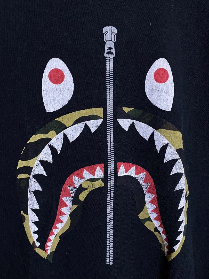 Bape Shark Green Camou Tee (Category: Tshirts & Polo Shirts ) located in Makati City. Submitted by earnx_ (Listing ID 1443541451, Image 2). Description: Bape Shark Green Camou Tee Size large on tag Authentic/Legit Dimension is 20x26 Issue hairline cracked only.