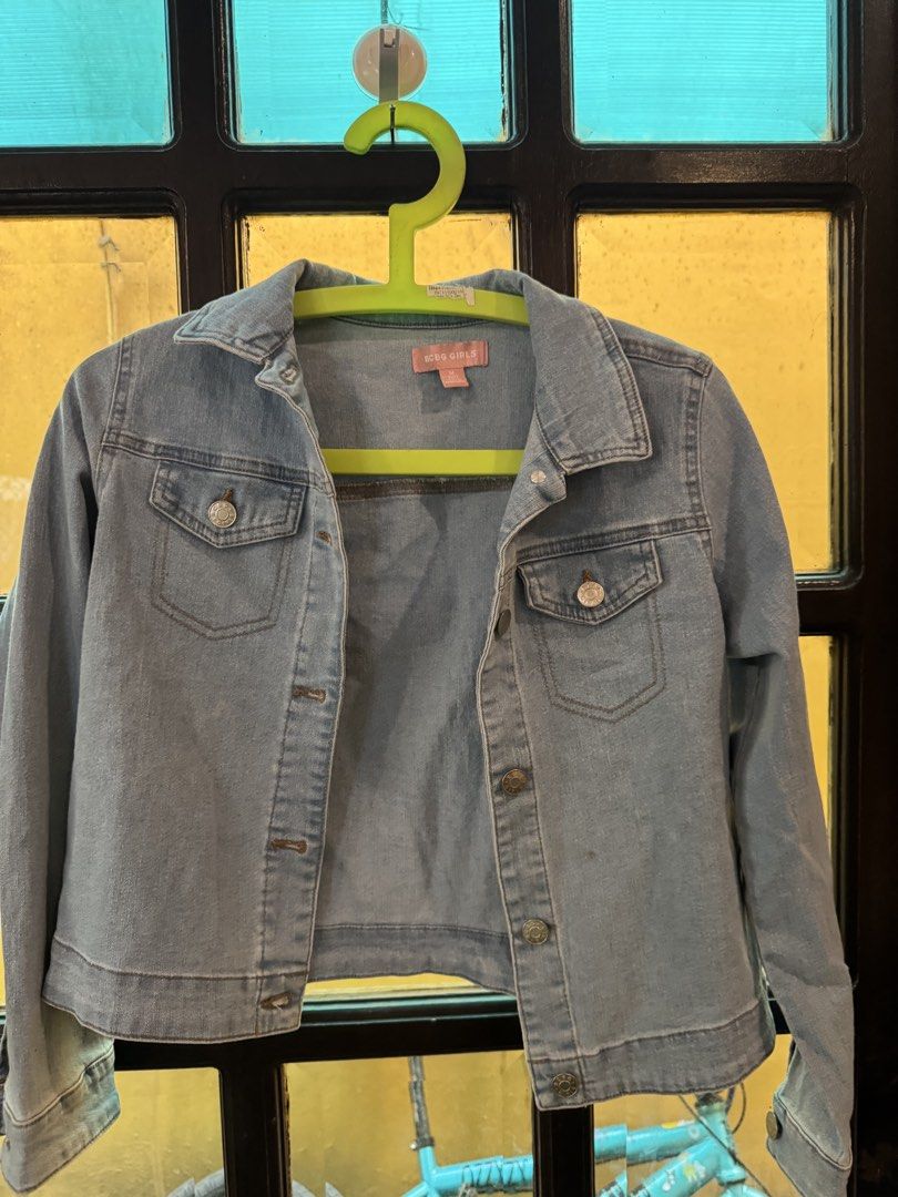 BCBG Girls Denim Jacket Size M (10/12) (Category: Coats, Jackets and Outerwear) located in Cainta. Submitted by dyamezph (Listing ID 1443604238, Image 1). Description: - Light wash denim jacket for girls - Classic button-up style - Features two chest pockets - Made in Bangladesh - Ideal for layering over any outfit - Easy to wear and style.