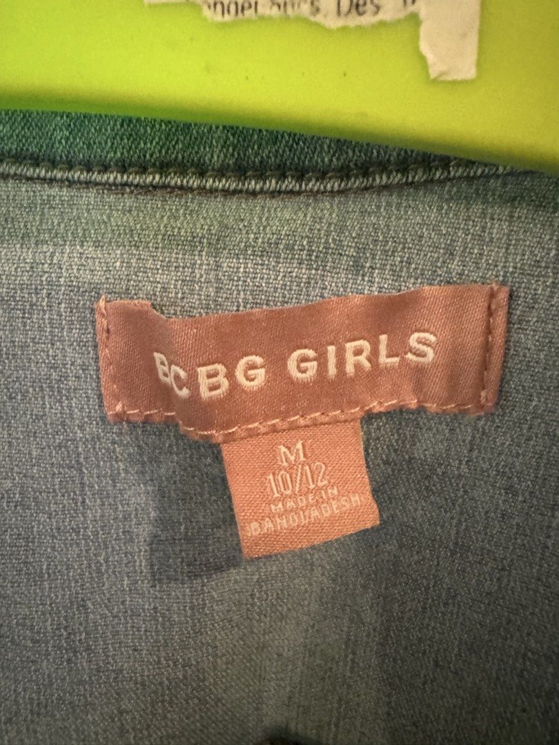 BCBG Girls Denim Jacket Size M (10/12) (Category: Coats, Jackets and Outerwear) located in Cainta. Submitted by dyamezph (Listing ID 1443604238, Image 2). Description: - Light wash denim jacket for girls - Classic button-up style - Features two chest pockets - Made in Bangladesh - Ideal for layering over any outfit - Easy to wear and style.