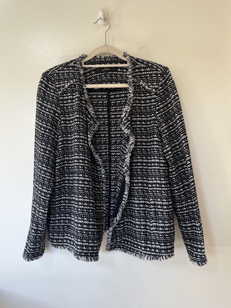 Black and White Tweed Fringed Blazer Jacket (Category: Coats, Jackets and Outerwear) located in Baguio. Submitted by mikmikshope (Listing ID 1443656598, Image 3). Description: - Fit to Semi Large -Classic black and white tweed blazer - Stylish fringed trim on edges and lapels - Single button closure - Perfect for dressing up or down - Ideal for layering over tops or dresses - Suitable for work or a night out.
