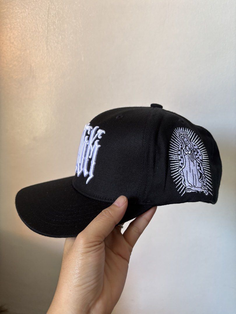 Black DGM Snapback Cap with White Embroidery (Category: Caps & Hats) located in Davao. Submitted by truepenguin_f2a806 (Listing ID 1443638856, Image 2). Description: - Black snapback cap - White DGM embroidery on the front - 'ALL DAY' embroidery on the back - Virgin Mary embroidery on the side - Brand new with tags attached - Ideal for casual wear.