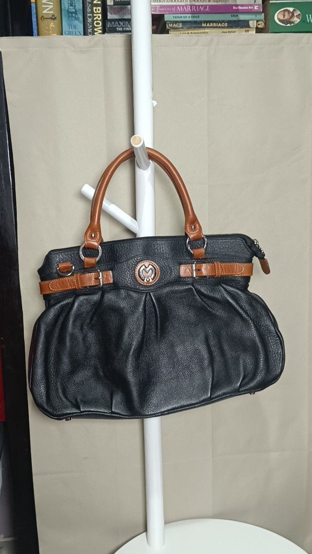 Black Leather Handbag with Brown Straps and Handle (Category: Luxury Bags & Wallets) located in Antipolo. Submitted by secondmusebags (Listing ID 1443663670, Image 2). Description: We sell authentic preloved bags 😊 Condition: Good as new with minimal signs of usage Can send more photos or vids of the bag Price is negotiable for 2 bags and up Tiktok: secondmusebags Location: Upper Antipolo Available for meetup Delivery: Lalamove or J&T Black leat