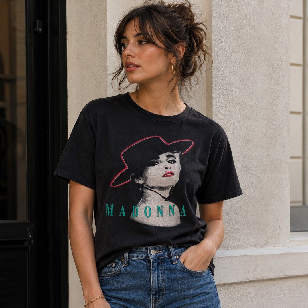 Black Madonna Graphic T-Shirt (Category: Tshirts & Polo Shirts ) located in Dapitan. Submitted by payt3es_thrift. (Listing ID 1443547992, Image 1). Description: - Black t-shirt with a graphic print of Madonna - Features Madonna's name below the image - Made in Korea - Ideal for any Madonna fan - Please check photos for detailed measurements.