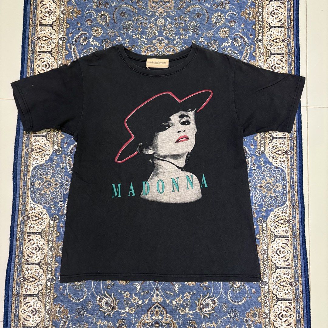 Black Madonna Graphic T-Shirt (Category: Tshirts & Polo Shirts ) located in Dapitan. Submitted by payt3es_thrift. (Listing ID 1443547992, Image 2). Description: - Black t-shirt with a graphic print of Madonna - Features Madonna's name below the image - Made in Korea - Ideal for any Madonna fan - Please check photos for detailed measurements.
