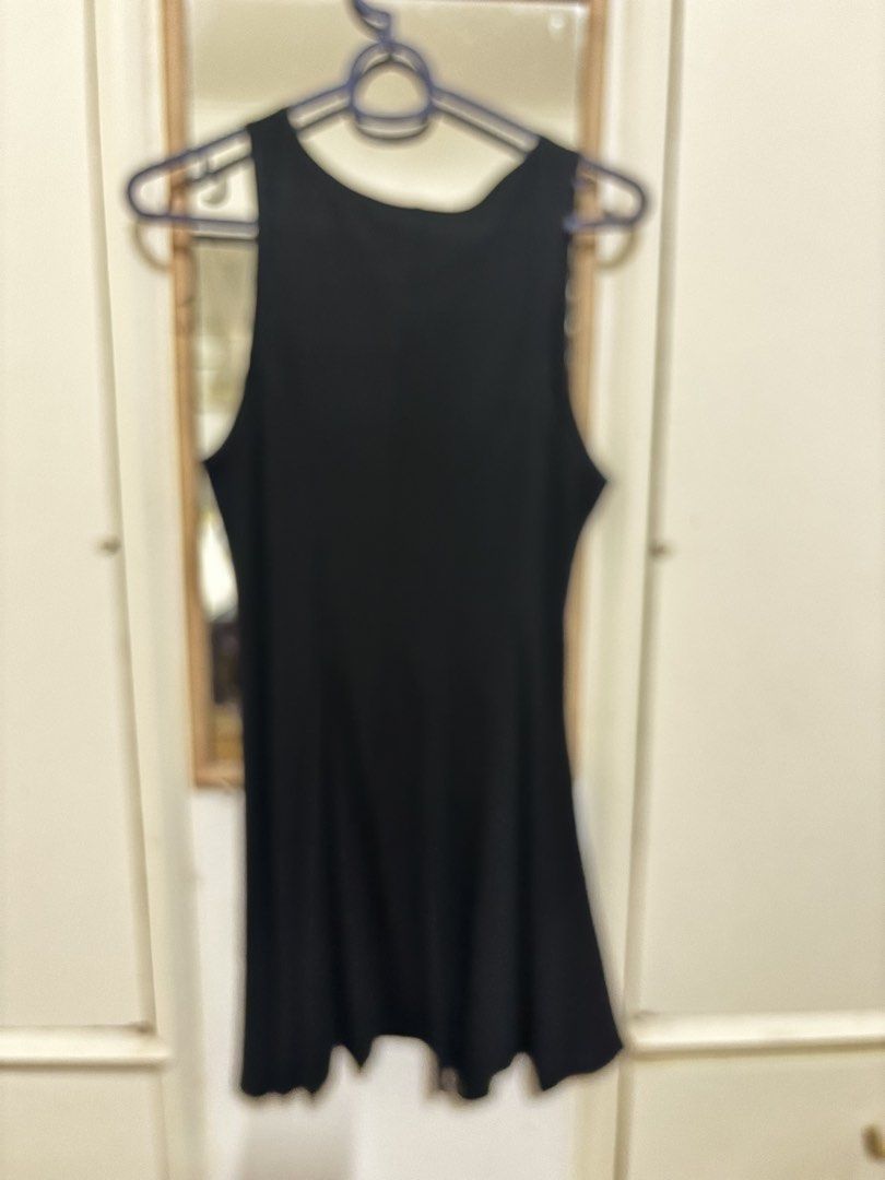 Black Sleeveless A-line dress (Category: Sleeveless) located in Makati City. Submitted by chumi10 (Listing ID 1443634236, Image 1). Description: - Basic black sleeveless tank top - Simple and versatile design - Perfect for dressing up or down - Ideal for layering or wearing solo - Features a fabric with a nice drape - Offers a comfortable fit.