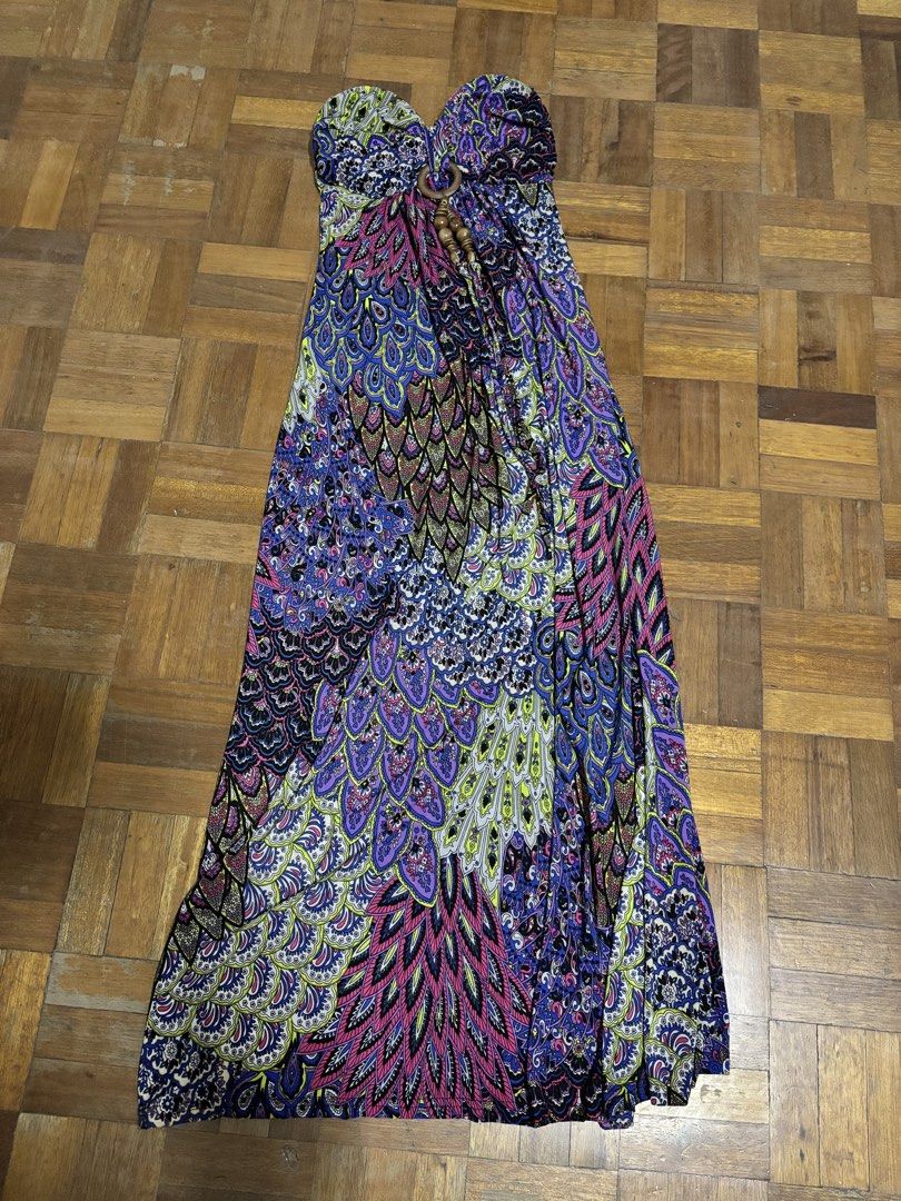 Boho Strapless Maxi Dress with Peacock Feather Print (Category: Dresses) located in Makati City. Submitted by chumi10 (Listing ID 1443644339, Image 1). Description: - Vibrant strapless maxi dress - Bold peacock feather-inspired print (blues, purples, pinks, greens) - Tie-back halter strap - Flowy and comfortable fabric - Ideal for beach days or summer evenings - Unique, eye-catching design.