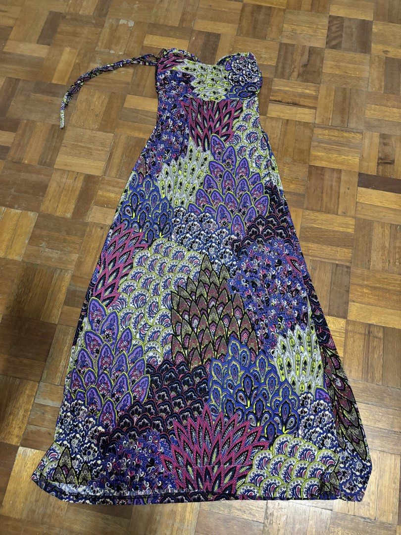 Boho Strapless Maxi Dress with Peacock Feather Print (Category: Dresses) located in Makati City. Submitted by chumi10 (Listing ID 1443644339, Image 2). Description: - Vibrant strapless maxi dress - Bold peacock feather-inspired print (blues, purples, pinks, greens) - Tie-back halter strap - Flowy and comfortable fabric - Ideal for beach days or summer evenings - Unique, eye-catching design.