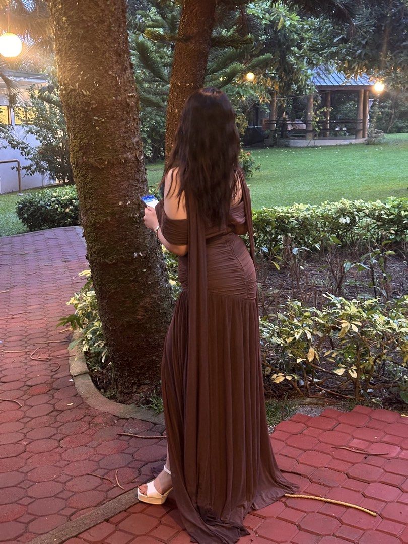 Brown Off-Shoulder Gown with High Slit (Category: Evening dresses & gowns) located in Paranaque City. Submitted by m.angeldizon (Listing ID 1443506557, Image 2). Description: For Sale : Elegant, Minimalist, Off shoulder, High slit gown Color: Chocolate Brown Reason for selling: Served its purpose, used once only as an entourage Actual photos when worn are posted No defects, No issues Original Price : 2k Selling for : 1500 + SF Height : 5ft with 3