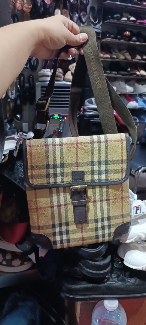 Burberry Nova Check Sling Bag (Category: Luxury Bags & Wallets) located in Koronadal. Submitted by milagraciaukayukay123_. (Listing ID 1443537592, Image 2). Description: - Classic Burberry Nova Check pattern - Genuine leather trim - Adjustable shoulder strap with Burberry logo - Ideal for everyday wear - Guaranteed authentic.