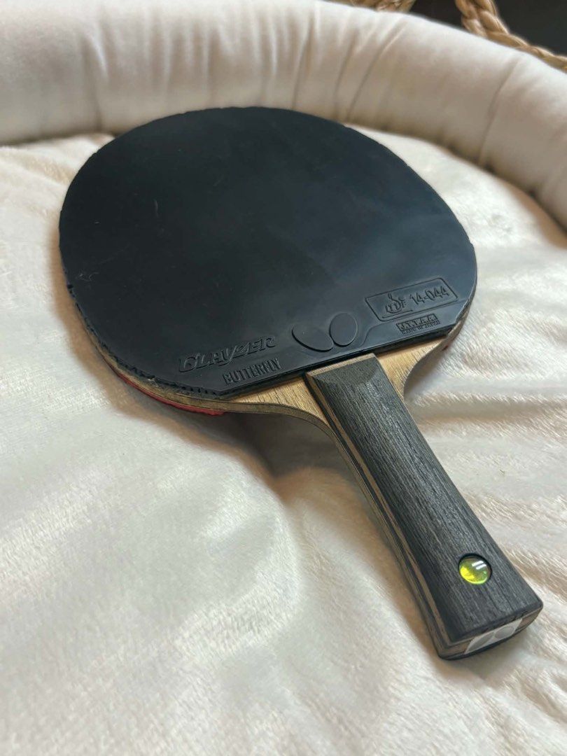 Butterfly Timo Boll TJ Table Tennis (Category: Racket and Ball Sports) located in Malolos. Submitted by dacrs. (Listing ID 1443527424, Image 1). Description: - Butterfly Timo Boll TJ blade - Black Butterfly Glayzer 2.1mm rubber on backhand - Red Butterfly Dignics 09c 2.1mm rubber on forehand - Made in Japan - Ideal for players seeking control and spin - Used condition (6 months).
