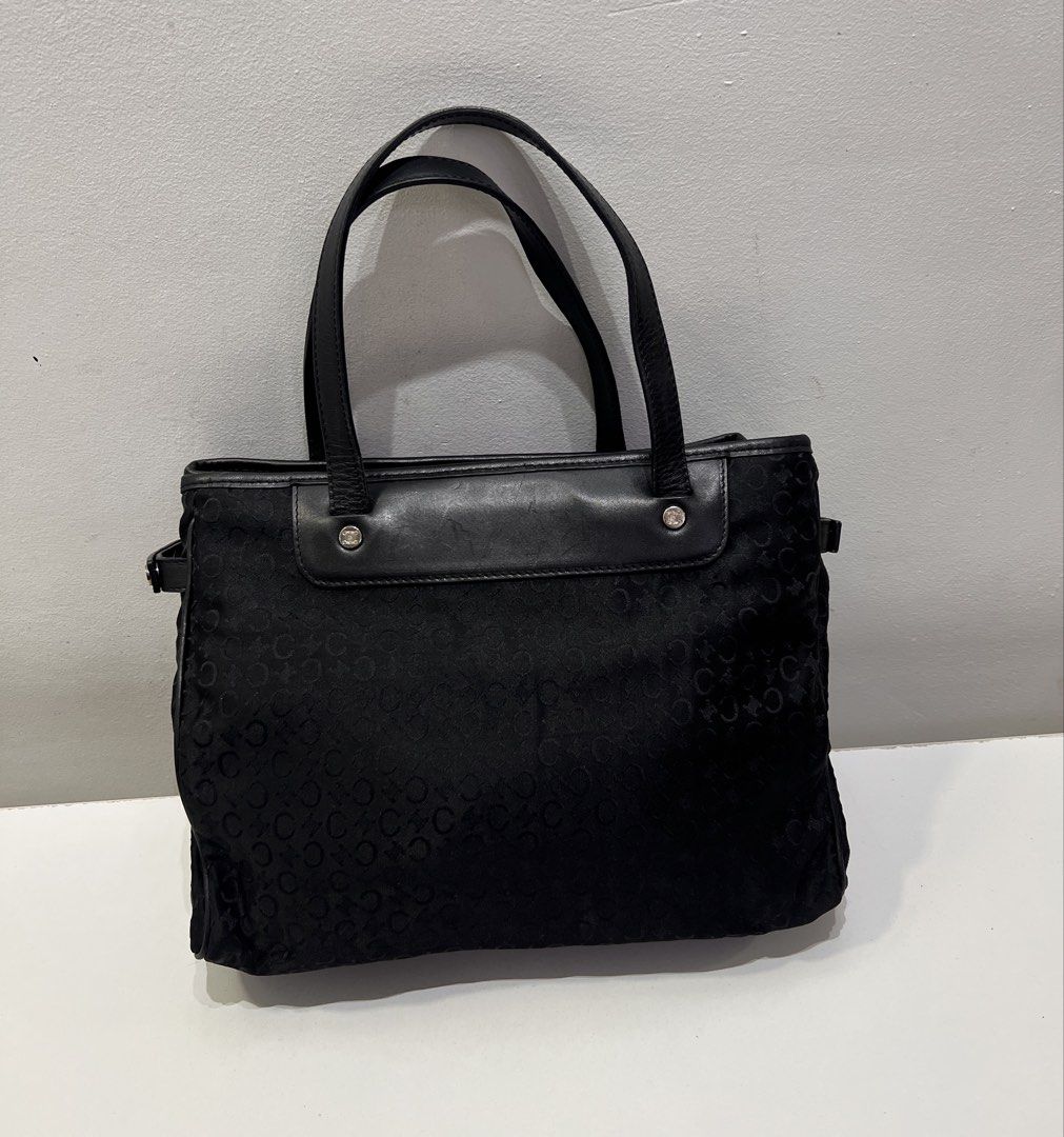 Celine Macadam Canvas Tote Bag (Category: Luxury Bags & Wallets) located in Cebu City. Submitted by brandedcorner_ph (Listing ID 1443695407, Image 2). Description: Pre-loved ((C))eline Macadam Canvas Tote Bag 100% Authentic or money back Condition • Excellent condition • No flaws • Minimal sign of usage only Product Details •Color: Black •Hardware: Silver tone •Material: Nylon & leather •Approximate Dimensions in inches: H8 x W10.5 x D3.5 Color m