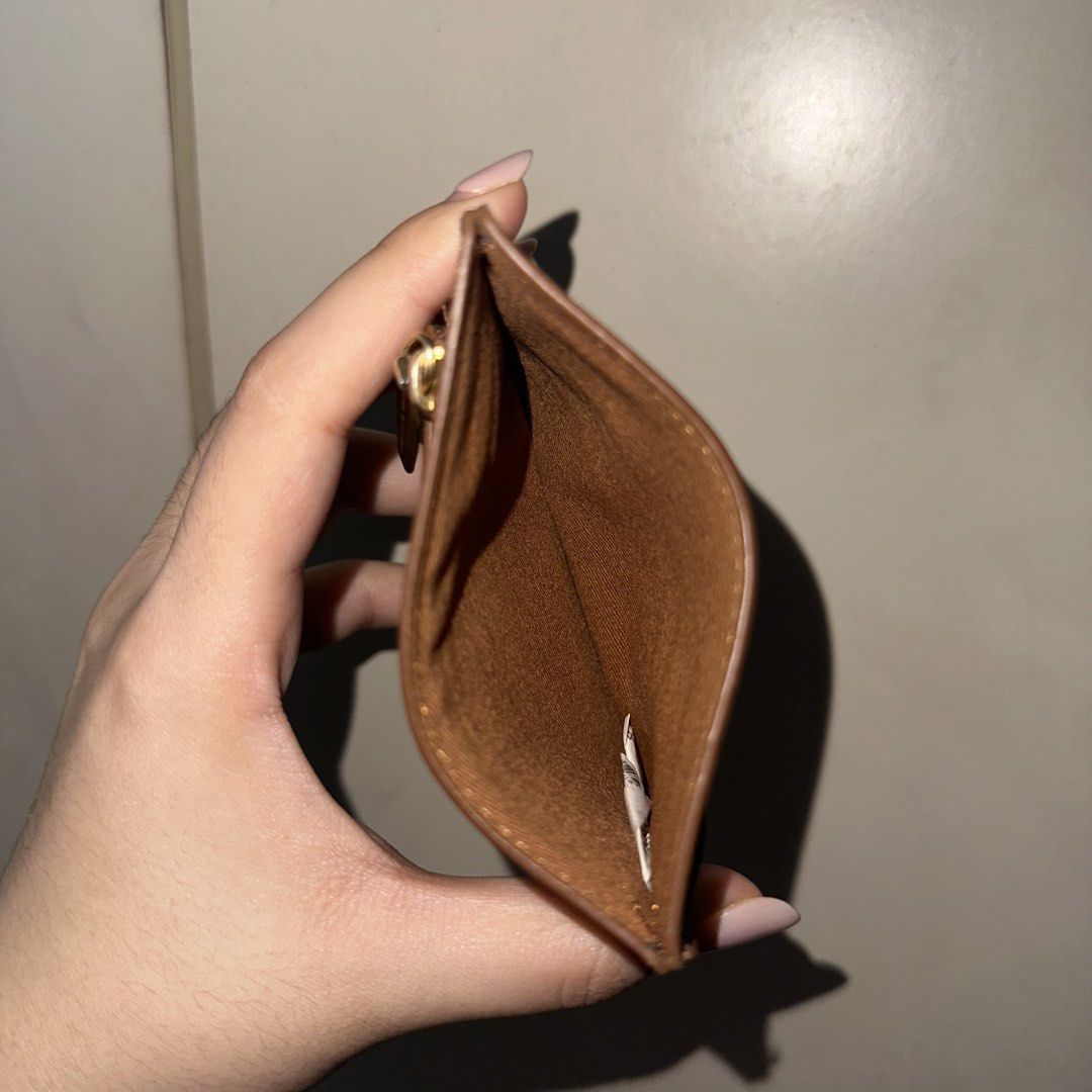 Charles & Keith Brown Card Holder with Zipper (Category: Wallets & Card holders) located in Quezon City. Submitted by getneedohdmnl (Listing ID 1443695298, Image 3). Description: Charles & Keith brown card holder with multiple card slots and a zippered compartment. DETAILS: - bought in BGC physical store - only flaw is the gold hardware: logo and zipper has signs of use already (faded a little) - card holder itself has no damages,, still looks br