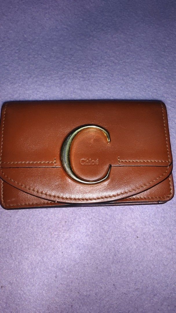Chloe Brown Leather Wallet with Gold C Logo (Category: Luxury Bags & Wallets) located in Angeles City. Submitted by miyaliwa.tapandshop (Listing ID 1443510702, Image 1). Description: - Authentic Chloe brown leather wallet - Iconic gold C logo on the front - Compact and perfect for essentials - Secure snap closure - Features Chloe branding inside free shipping until July 30.