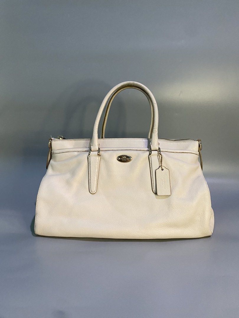 Coach Cream Leather Tote Bag (Category: Luxury Bags & Wallets) located in Cebu City. Submitted by nardcen (Listing ID 1443576491, Image 1). Description: - Authentic Coach cream leather tote bag - Secure main zip compartment - Comfortable top handles - Iconic Coach hang tag included - Spacious interior, ideal for daily essentials - Versatile and stylish for everyday wear.