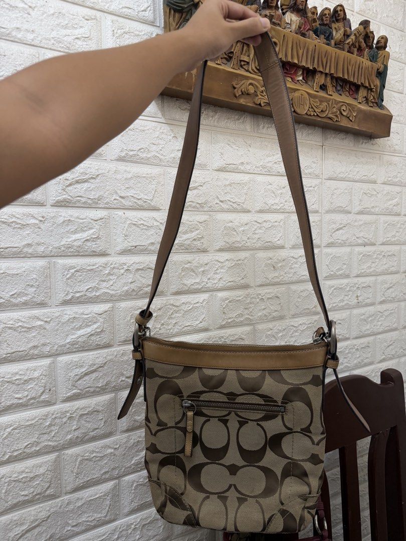 Preloved Coach Monogram Canvas Leather Shoulder Bag (Category: Luxury Bags & Wallets) located in Lipa City. Submitted by xynami (Listing ID 1443512838, Image 2). Description: GET ANY 2 OF MY COACH LISTINGS FOR 4,200 - helping my tita sell her coach bags Authentic Coach shoulder bag - Classic monogram canvas with tan leather trim - Secure zipper closure - Interior pockets for organization - Adjustable strap for comfortable fit - Perfect everyday b