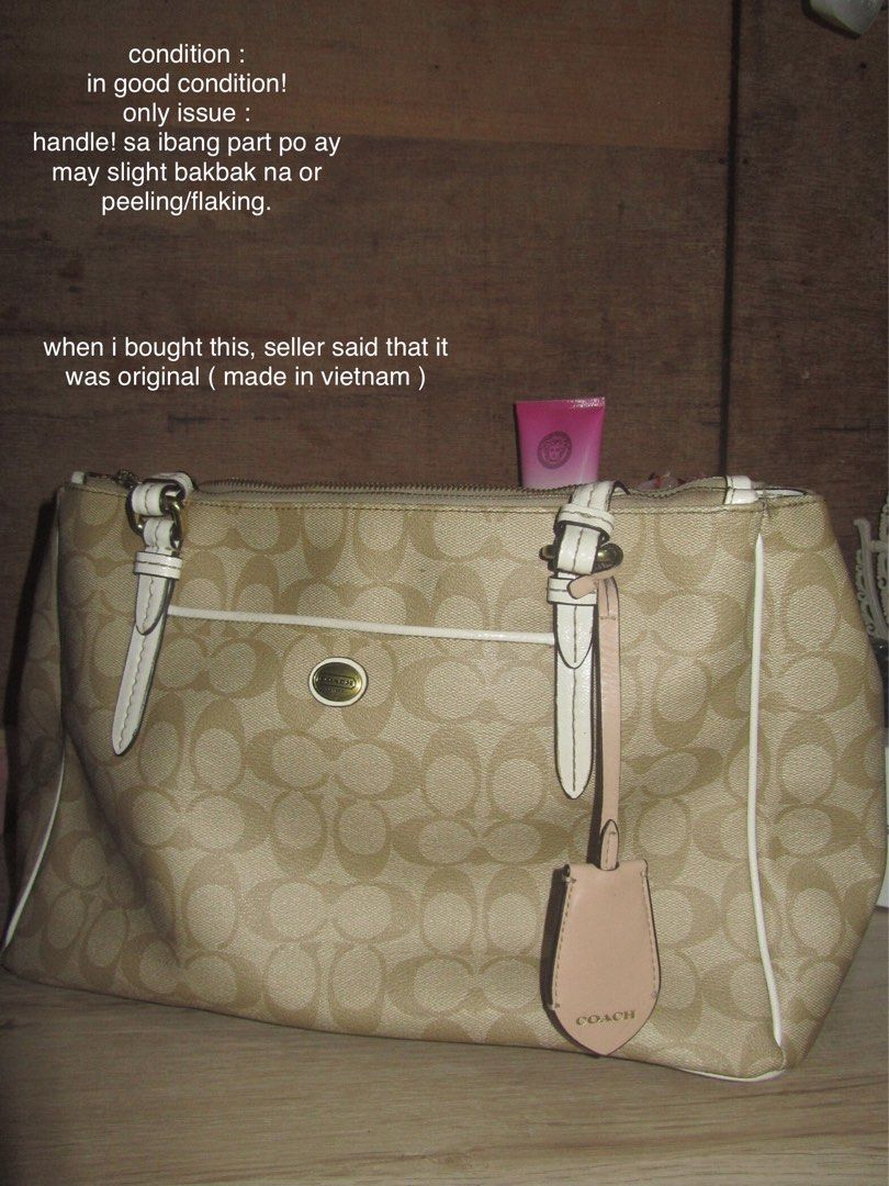 Coach Monogram Canvas Tote Bag (Category: Luxury Bags & Wallets) located in Cainta. Submitted by lovedleafs (Listing ID 1443612545, Image 2). Description: - Authentic Coach monogram canvas tote bag - Color: Beige with white trim and straps - Exterior pockets: 1 front open, 1 back open - Interior pockets: 1 zipper pocket, 1 additional zipper pocket, 2 small open pockets - Condition: Handle shows slight peeling/flaking - Origin: Made in Vietnam (as