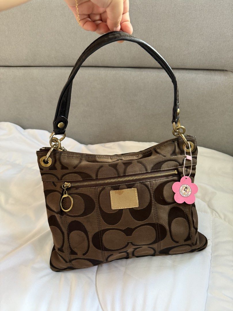Coach Poppy Choco Brown Hobo Bag (Category: Luxury Bags & Wallets) located in Calasiao. Submitted by nicnaks_collection (Listing ID 1443621766, Image 2). Description: 𐙚 ‧₊˚ ⋅ Cch Poppy Metallic Choco Brown ♡⸝⸝ All items are guaranteed authentic. ⟢ Normal signs of usage ⟢ crack creed front and inside ⟢ Gold hardware tarnish ⟢ stiff strap Kindly read our shop rules. Strictly no cancellation, exchange, return/refund of items. Make sure to double ch