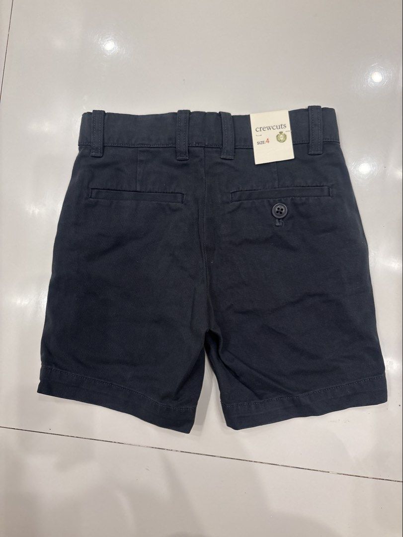 Crewcuts Navy Chino Shorts Size 4 (Category: Babies & Kids Fashion) located in Quezon City. Submitted by branded.ktk (Listing ID 1443596573, Image 2). Description: LENGTH - 30CM WAIST - 26CM (adjustable) - Navy blue chino shorts from Crewcuts - Size 4 - Adjustable waist inside for a perfect fit - Secure button and zip closure - Two front pockets and two back pockets - Ideal for everyday wear.