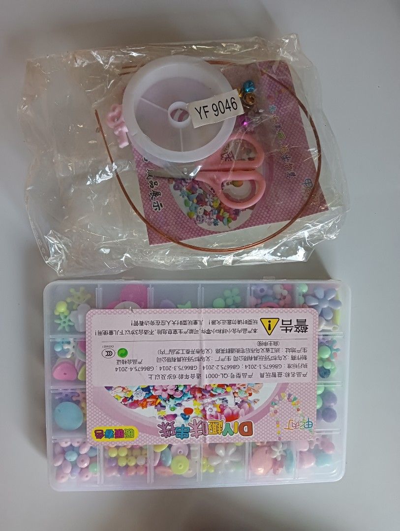 DIY Jewelry Making Kit with Beads, String, and Scissors (Category: Craft Supplies & Tools) located in Porac. Submitted by redapple24 (Listing ID 1443498213, Image 1). Description: - Fun DIY bead kit for making bracelets and necklaces. - Includes a variety of colorful beads in different shapes (flowers, fruits). - Comes with string, a small pair of pink scissors, and charms. - Great for kids or anyone who loves crafting. - Everything is neatly org