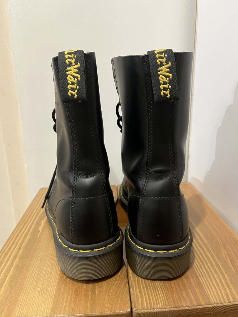 Dr. Martens 14 Eyelet Black Leather Boots (Category: Boots) located in Makati City. Submitted by mecca23 (Listing ID 1443565776, Image 2). Description: - Classic Dr. Martens 14 eyelet boots - Black leather - Iconic yellow stitching - Air-cushioned sole - Original 14-eye design - Pre-loved, with plenty of life left - Perfect for everyday wear RFS: no longer fits my personal style .