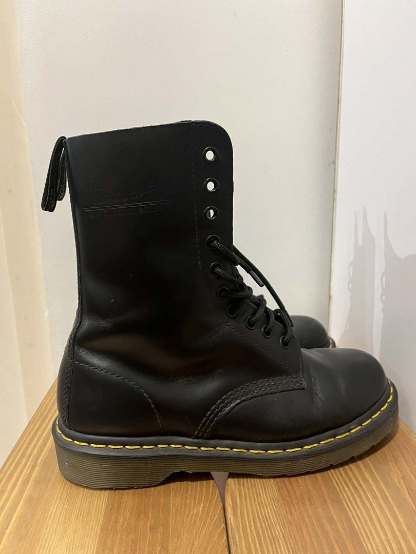 Dr. Martens 14 Eyelet Black Leather Boots (Category: Boots) located in Makati City. Submitted by mecca23 (Listing ID 1443565776, Image 3). Description: - Classic Dr. Martens 14 eyelet boots - Black leather - Iconic yellow stitching - Air-cushioned sole - Original 14-eye design - Pre-loved, with plenty of life left - Perfect for everyday wear RFS: no longer fits my personal style .