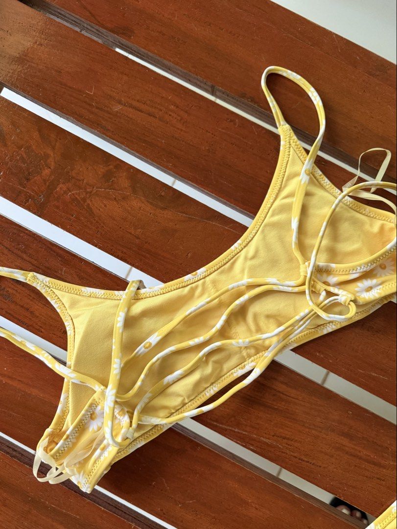 F21 Yellow Daisy Print Bikini Set (Category: Bikinis & Swimsuits) located in Makati City. Submitted by declutterbytina (Listing ID 1443538127, Image 2). Description: Cute yellow daisy print bikini. Adjustable tie straps on top and sides. Perfect for beach or pool. Rfs doesn’t fit me anymore .