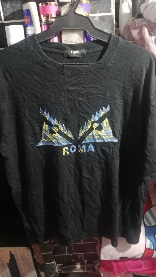 Fendi Roma T-Shirt (Category: Tshirts & Polo Shirts ) located in Manila. Submitted by thrift_on_the_street (Listing ID 1443613808, Image 1). Description: - Authentic Black Fendi T-shirt - Iconic FF motif and 'Roma' detail - Made in Italy - Size: Large (L) - Ideal for casual wear.