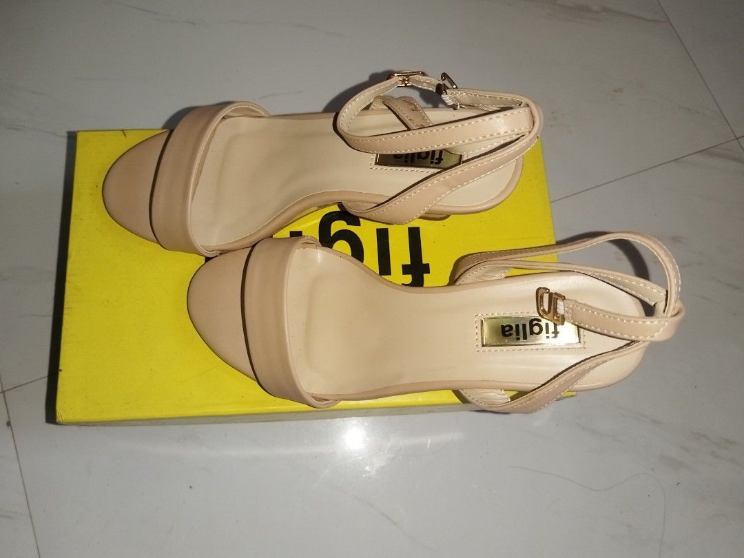 Figlia Wedge Sandals Beige Slingback Heels (Category: Heels) located in Manila. Submitted by everythingmustgo.18 (Listing ID 1443592456, Image 2). Description: - Brand: Figlia - sinukat once. Original price 1,499 but got it during their promo for 999 - Style: Slingback Wedge Sandals - Color: Beige - Features: Ankle strap with buckle closure - Heel: Wedge heel for added height - Condition: Comes with original box and packaging - Versatility: Perfe