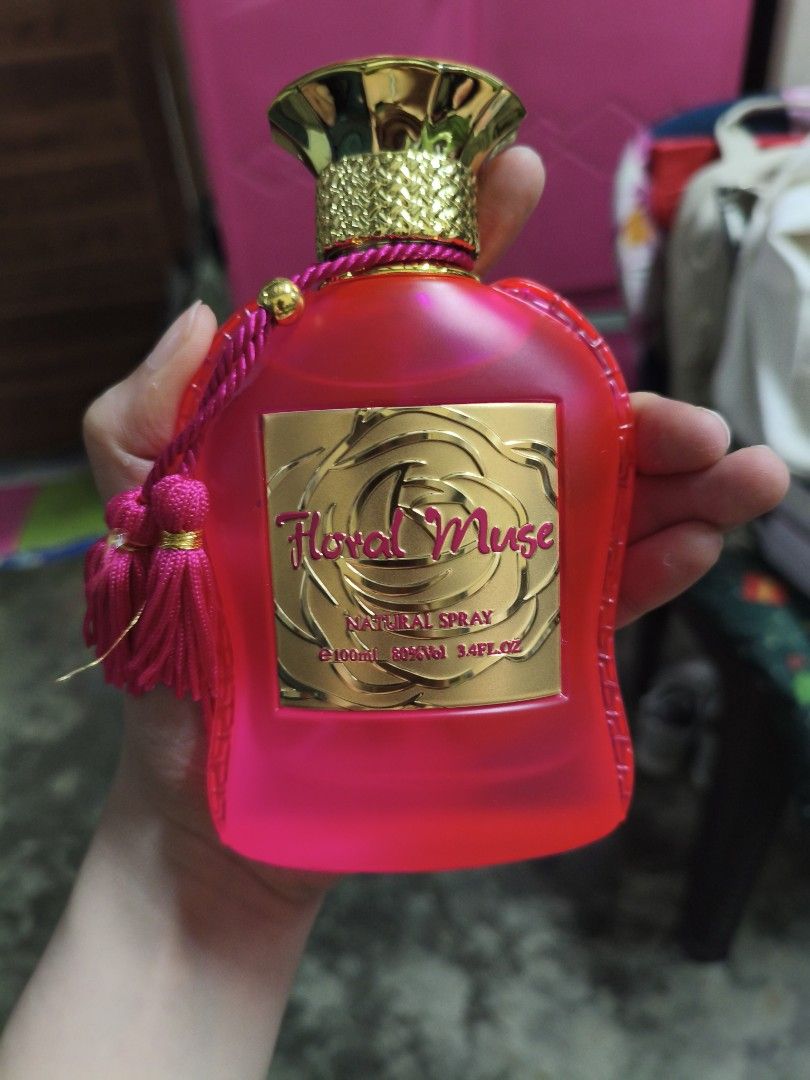 Floral Muse Natural Spray Perfume (Category: Fragrance & Deodorants) located in Quezon City. Submitted by cathian (Listing ID 1443609600, Image 1). Description: - Floral Muse Natural Spray perfume - Bright pink bottle with elegant gold accents - Features a delightful floral fragrance - Ideal for daily use or special events - Decorative tassels on the bottle - Size: 3.4 fl oz Nayupi lang ung box pero never been used. Original.