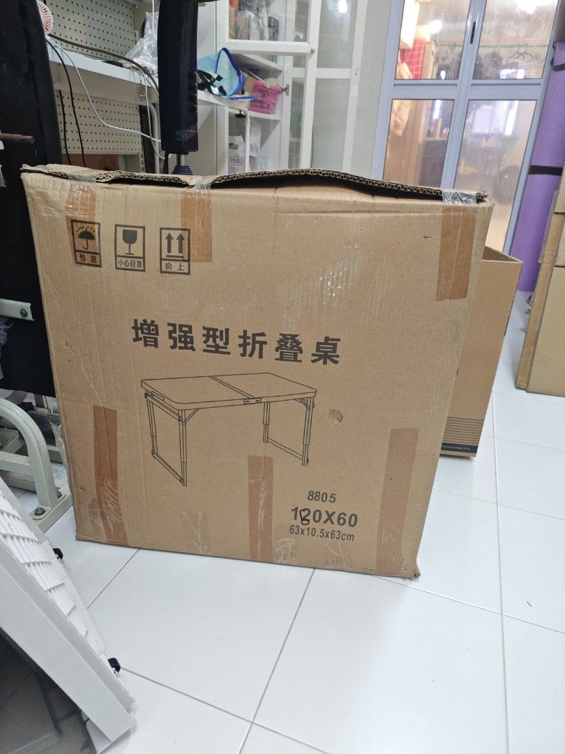 Folding Table 180x60cm (Category: Tables & Sets) located in Singapore. Submitted by joyce_ken (Listing ID 1443606708, Image 1). Description: - Foldable table - Dimensions: 180x60cm (as per box) 63x10.5x63cm - Sturdy and versatile design - Folds flat for easy storage - Perfect for small spaces or extra workspace - Use twice only, kept in box. Self pickup from 22 Bedok South Ave 1, S460022..