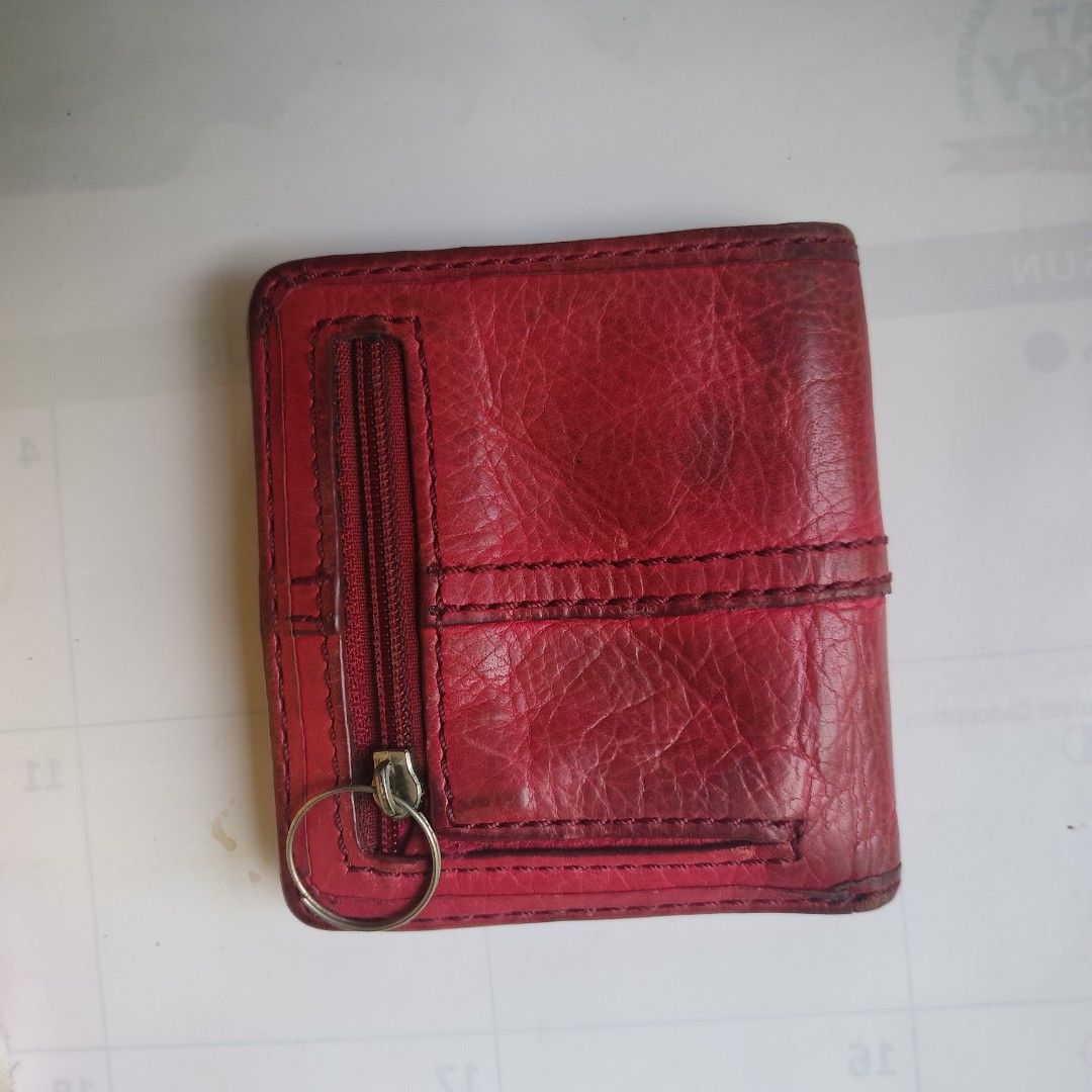 Fossil Red Leather Bifold Wallet with Key Ring (Category: Wallets & Card holders) located in Pasig City. Submitted by hapibibiness (Listing ID 1443539197, Image 3). Description: Authetic Fossil and Genuine Leather -Bifold wallet, Red - Side zip pocket with key ring - Interior card slots and clear ID window - Shows some signs of wear (edges, inside) - Still functional and durable for everyday use -Compact size.