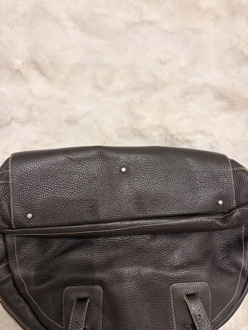 Furla Brown Leather Handbag (Category: Luxury Bags & Wallets) located in Mandaluyong City. Submitted by seafoamint (Listing ID 1443499955, Image 2). Description: Authentic (same silhouette as the ysl muse sac) - Dark brown pebbled leather - Textured finish with contrast stitching details - Convenient zippered pocket on the front - Stylish metal stud accents - Comfortable top handles - Roomy interior for all your essentials Size:width: 15.7inches 