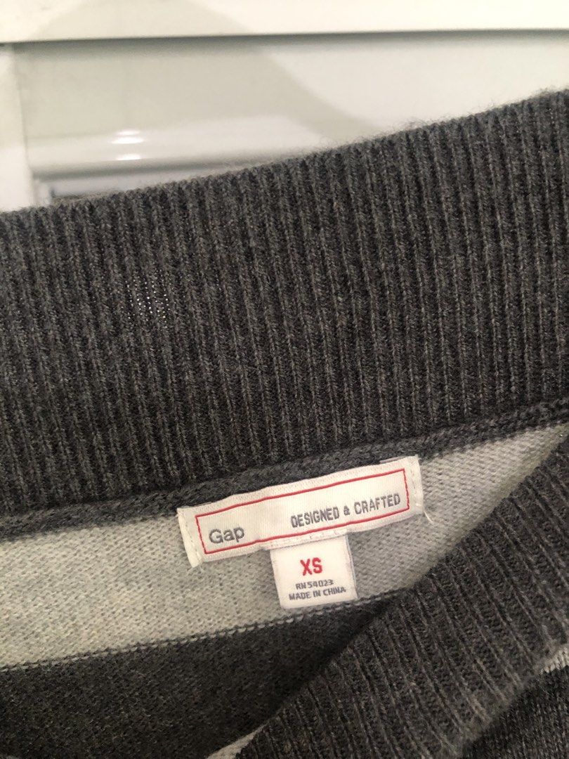 Gap Striped Boat Neck Long Sleeve Sweater (Category: Longsleeves) located in Manila. Submitted by rshay (Listing ID 1443524187, Image 3). Description: - Grey and light grey striped sweater - Boat neck style with long sleeves - Made of soft knit material - Versatile for layering or wearing solo - Easy to pair with jeans or skirts - Comfortable and casual - Oversized; can fit up to large.