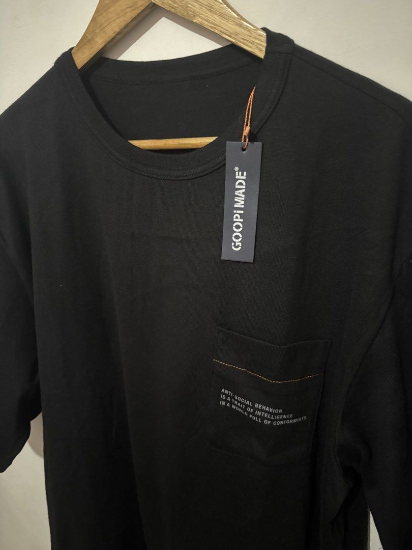 GOOPIMADE Black Graphic T-Shirt (Category: Tshirts & Polo Shirts ) located in Subic. Submitted by thriftpoison (Listing ID 1443556438, Image 2). Description: - GOOPIMADE Pocket Graphic Tee - Features a graphic print on the back - Text detail on the chest pocket - Coordinates printed on the sleeve - Comfortable and stylish for casual wear - Freesize - Length32 Width 25.