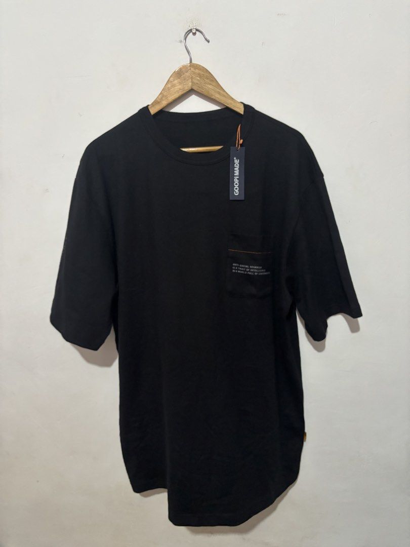 GOOPIMADE Black Graphic T-Shirt (Category: Tshirts & Polo Shirts ) located in Subic. Submitted by thriftpoison (Listing ID 1443556438, Image 1). Description: - GOOPIMADE Pocket Graphic Tee - Features a graphic print on the back - Text detail on the chest pocket - Coordinates printed on the sleeve - Comfortable and stylish for casual wear - Freesize - Length32 Width 25.