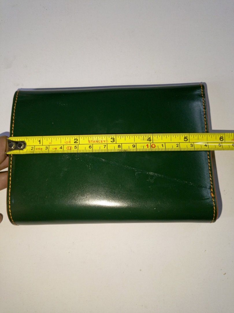B: Green Leather Medium Wallet (Category: Wallets & Card holders) located in San Pedro. Submitted by elevens_online_thrift_shop (Listing ID 1443607676, Image 2). Description: good condition except yung line sa likod, zoom pic made of leather and nylon material matigas ang structure.