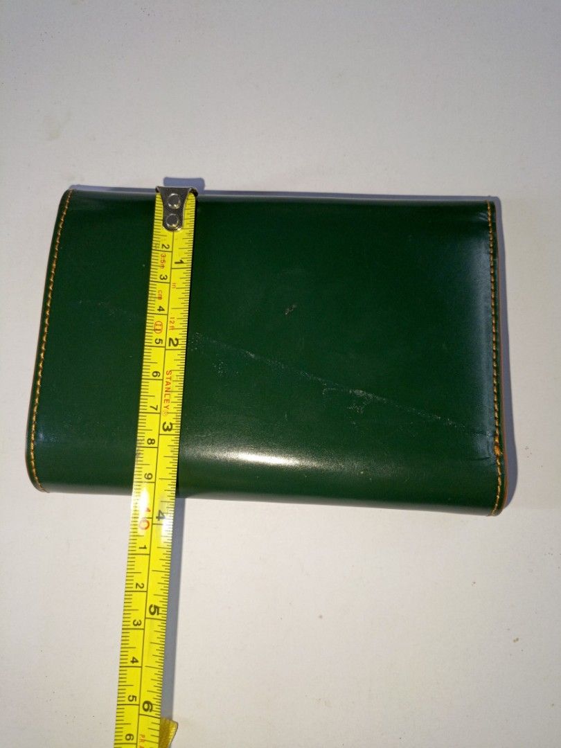 B: Green Leather Medium Wallet (Category: Wallets & Card holders) located in San Pedro. Submitted by elevens_online_thrift_shop (Listing ID 1443607676, Image 3). Description: good condition except yung line sa likod, zoom pic made of leather and nylon material matigas ang structure.