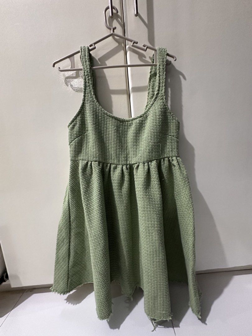 Green Textured Mini Dress with Raw Hem (Category: Dresses) located in Manila. Submitted by loved_ag (Listing ID 1443527915, Image 2). Description: - Adorable green mini dress - Textured fabric all over - Flattering square neckline with tank straps - Elasticated waist for a comfortable fit - Flowy flared skirt - Trendy raw hem detail - Versatile for casual outings or dressing up.