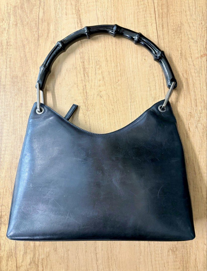 Gucci Black Leather Bamboo Handle Bag (Category: Luxury Bags & Wallets) located in Manila. Submitted by thriftpoint99 (Listing ID 1443671889, Image 2). Description: Issue cut tag need to replace and scratch sign of usage Good condition.